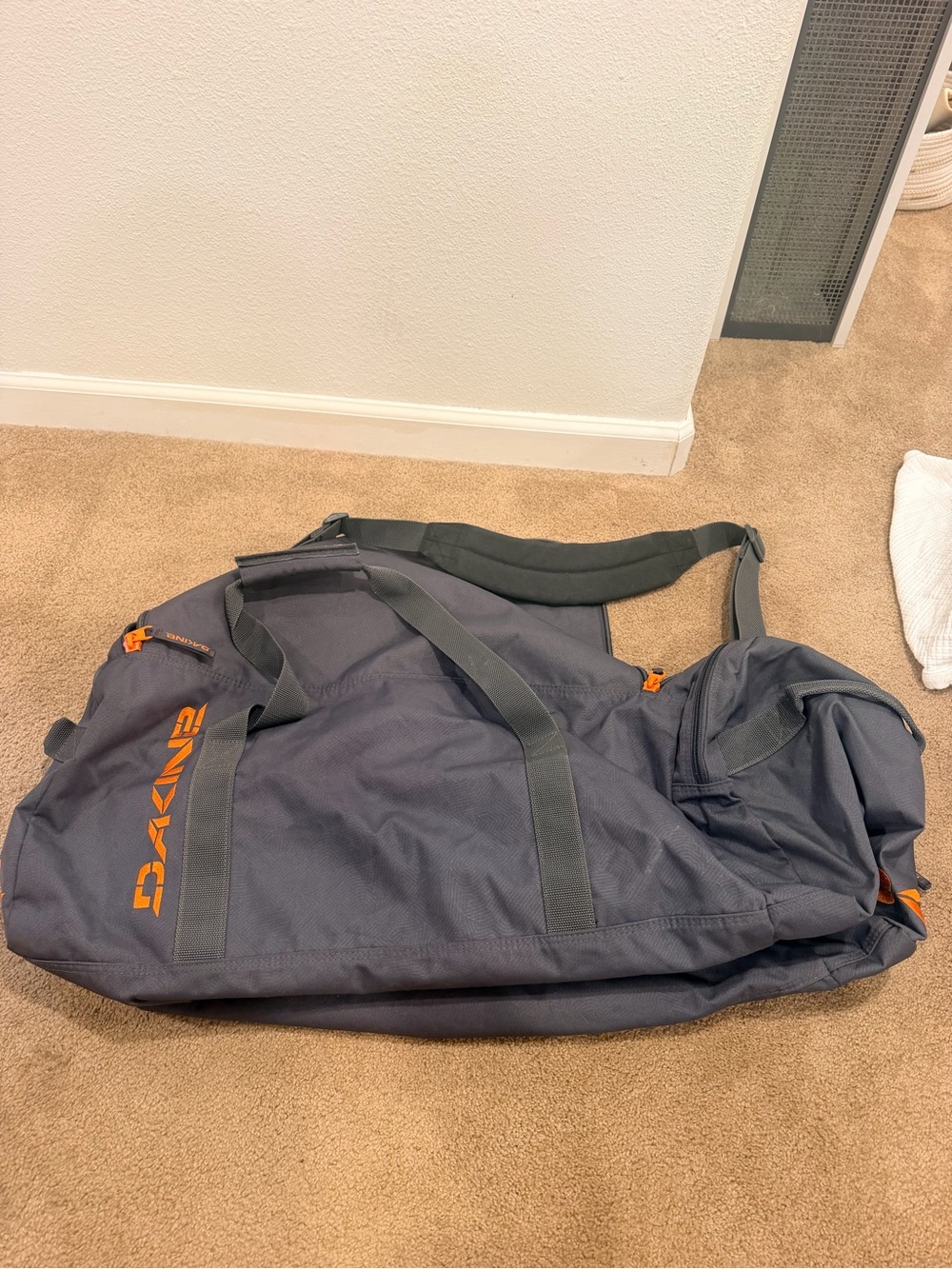 Dakine Charcoal Duffel Bag with Orange Logo Accents